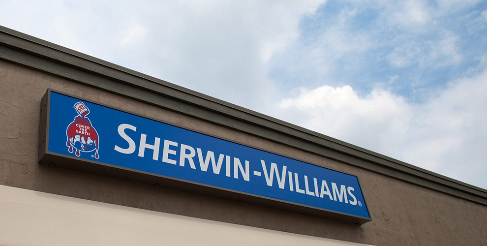 The exterior of a Sherwin-Williams store with the Sherwin-Williams sign in the center of the image.